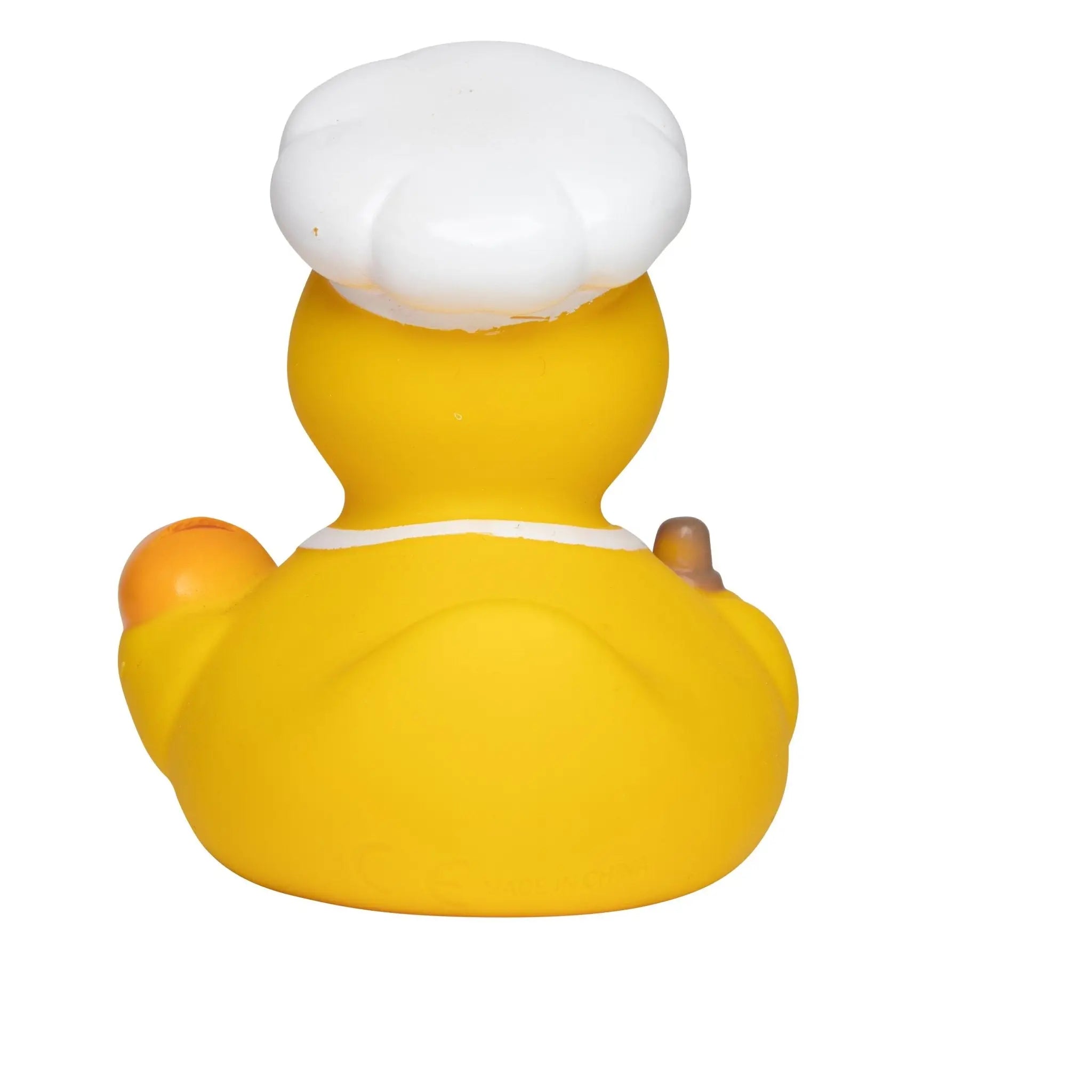 Gelbe quietsche-ente aus gummi mit weißer kochmütze als bäcker und energieberater badeente