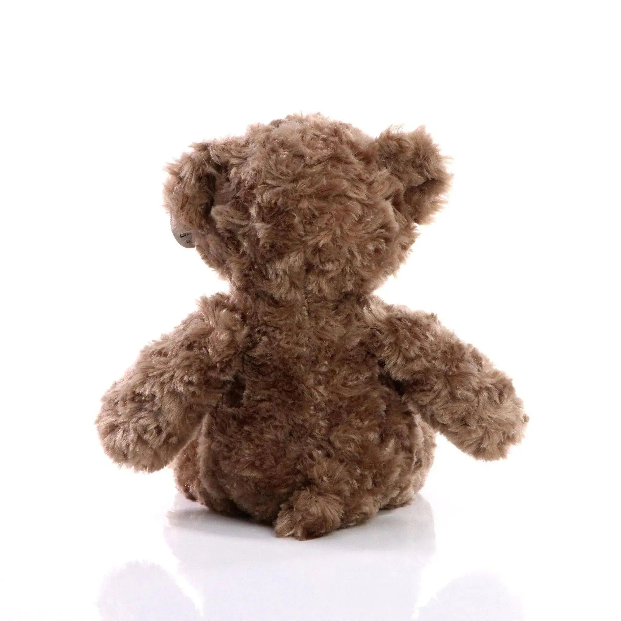 Fluffiger brauner bär bodo plüsch bär mit weichem lockigem fell und abgerundeten ohren als kuscheltier