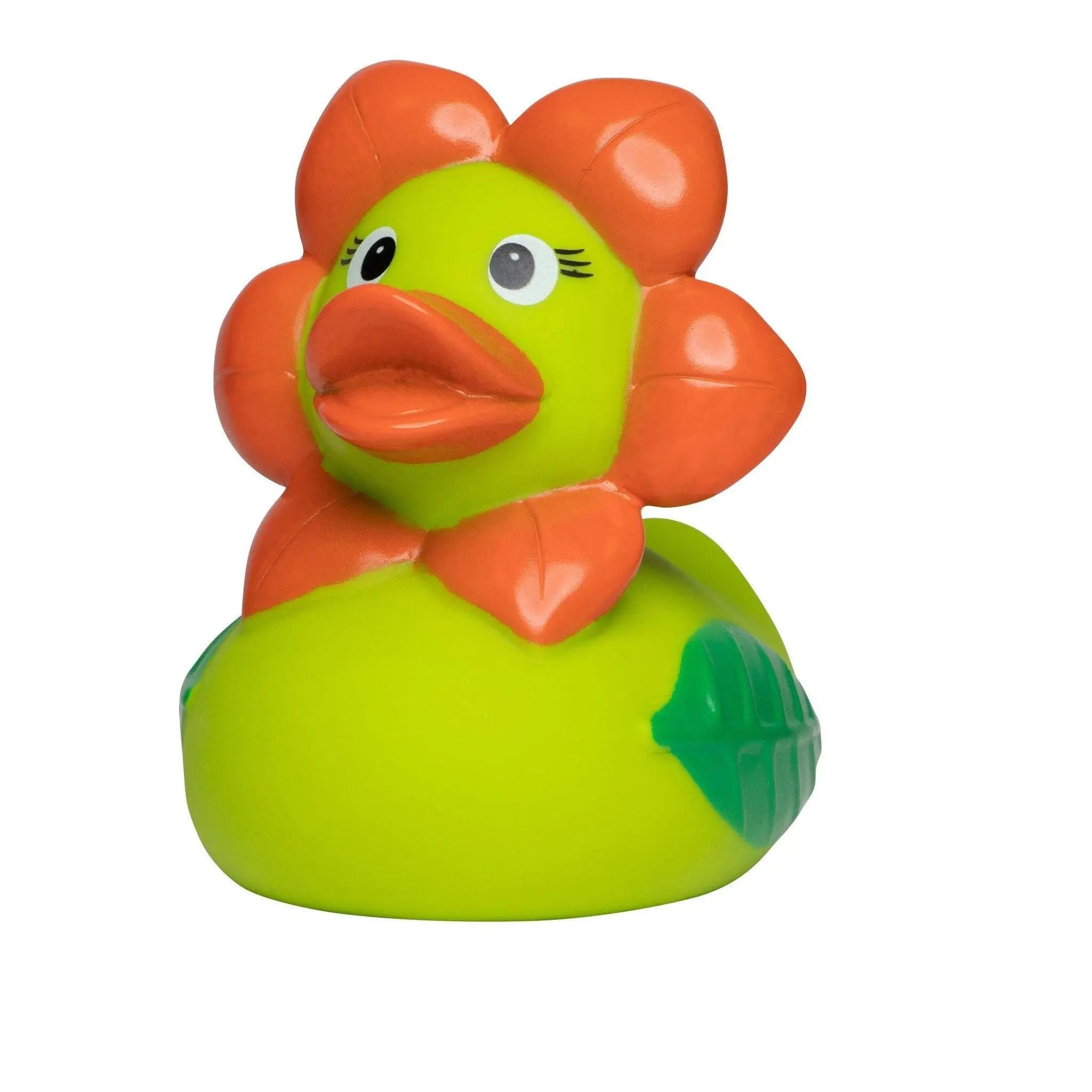 Eine grüne badeente aus gummi mit orangen blütenblättern und schleife namens blume mit schwarzen wimpern