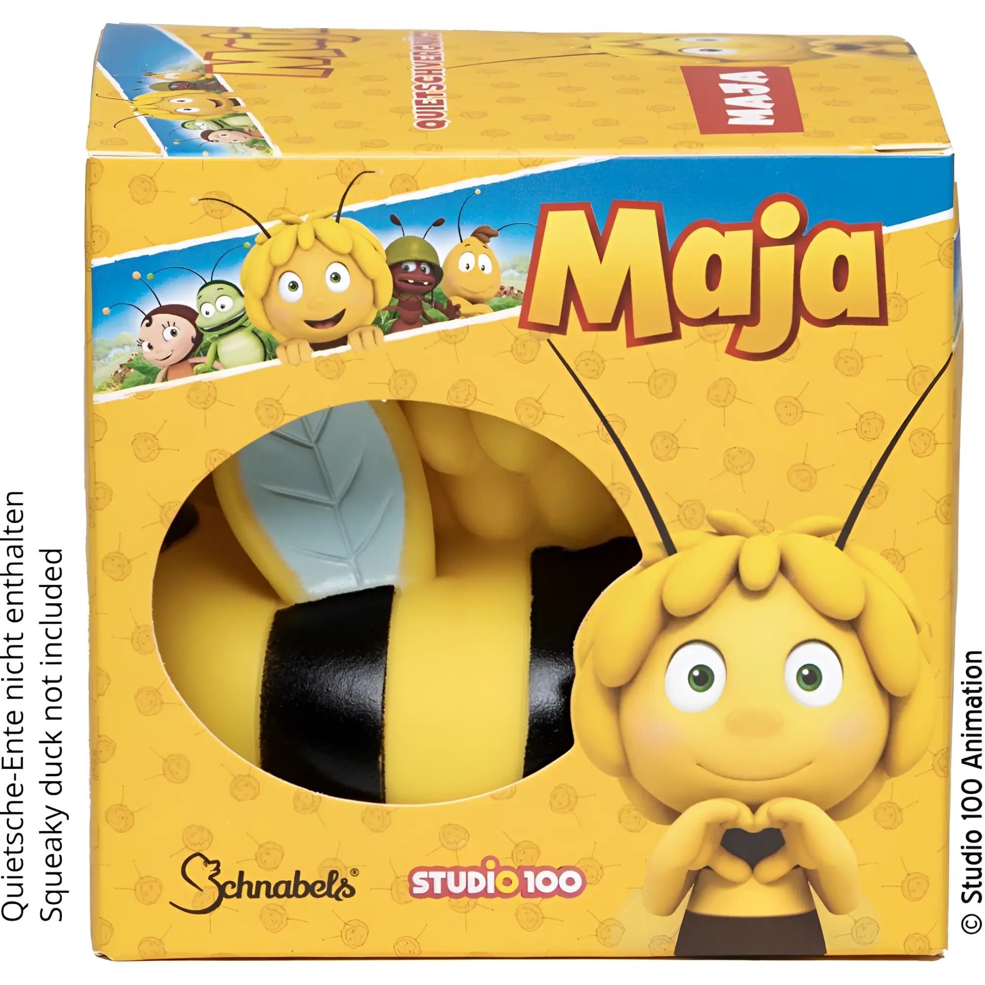Gelbe und schwarze plastik biene maja figur mit flauschigem gelbem haar, grünen augen und lächelndem gesicht im geschenkpaket