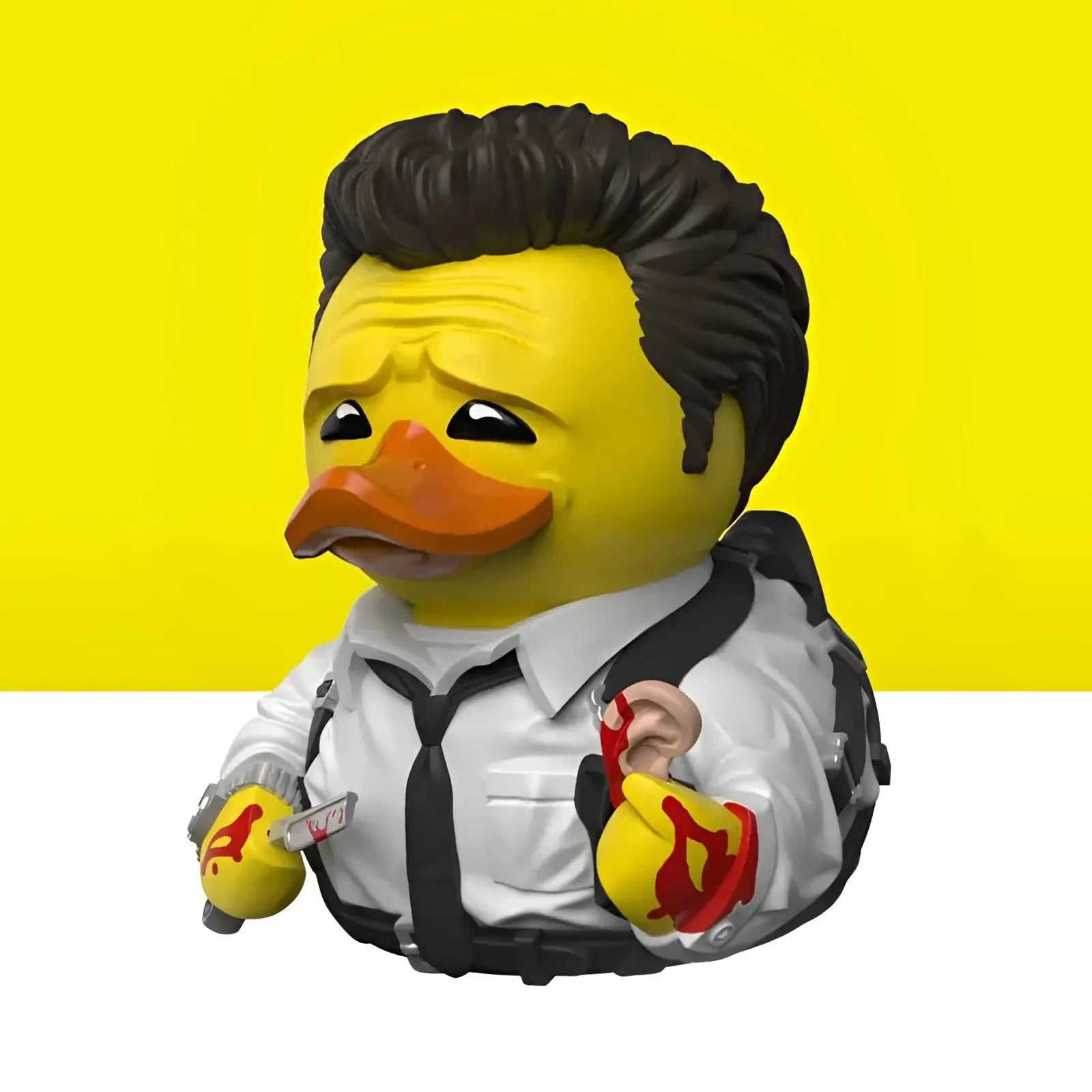 Gelbe gummiente figur als detective mit schwarzem haar weißem hemd und krawatte aus geschenkset reservoir dogs tubbz