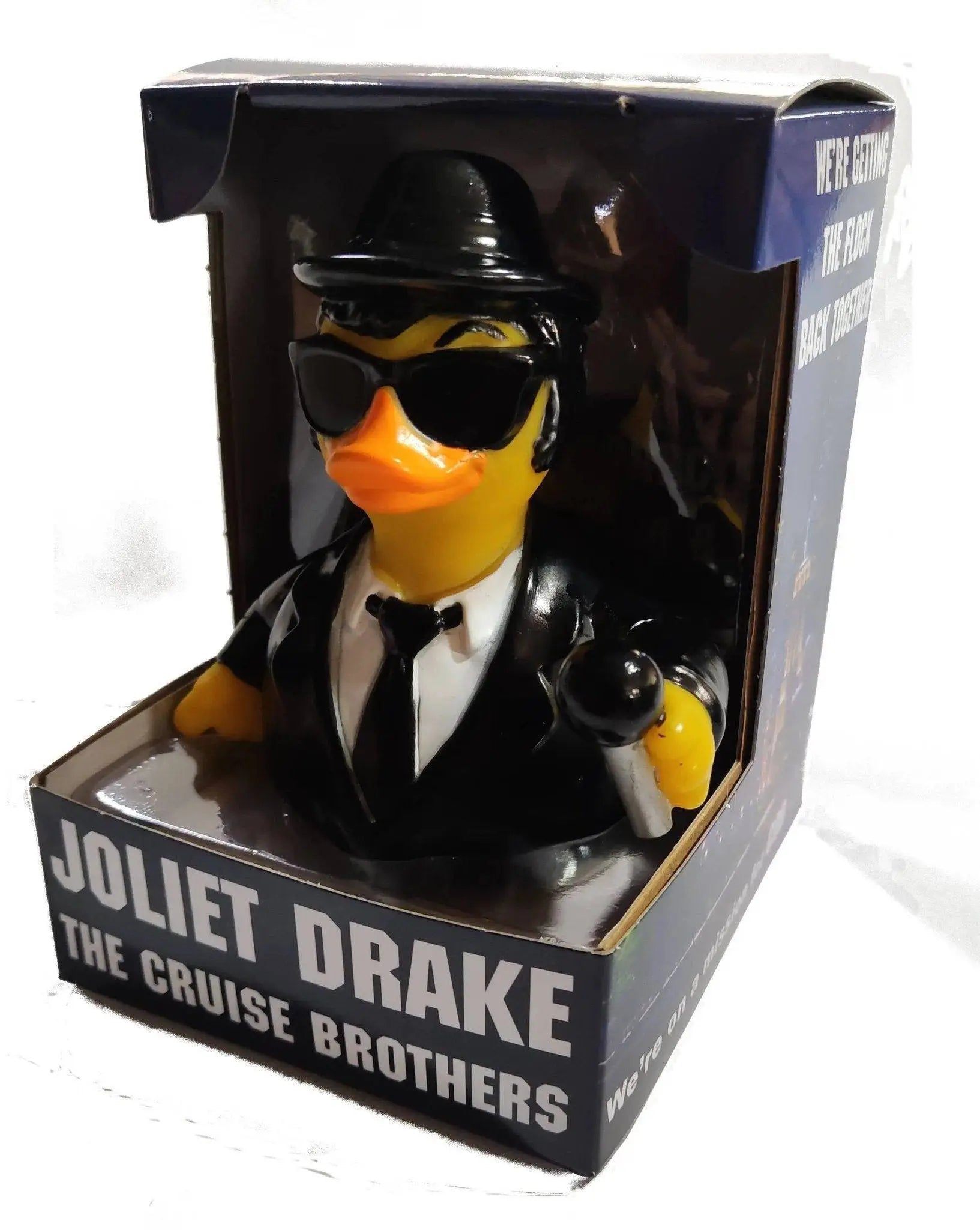 Ein schwarzer gummiente im stil eines detektivs mit fedora hut, sonnenbrille und anzug namens joliet drake von celebriducks