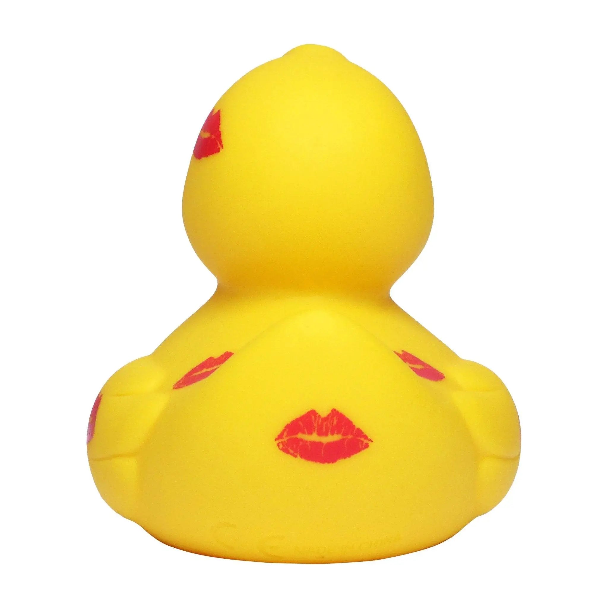 Eine knallgelbe badeente aus gummi mit mehreren roten kussmündern passend zu liebe und valentinstag