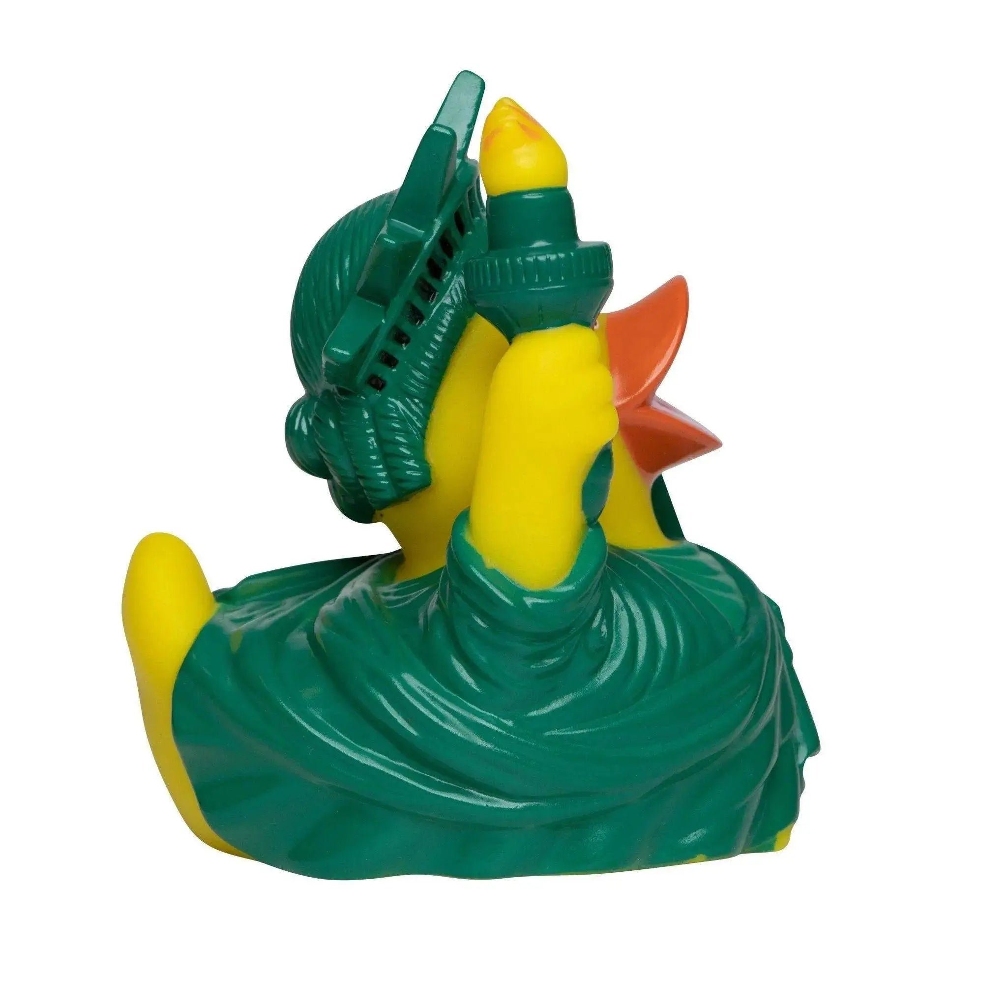 Gelbe quietscheente in liberty statue kostüm mit grüner krone orange beak und fackel für badezeit spaß