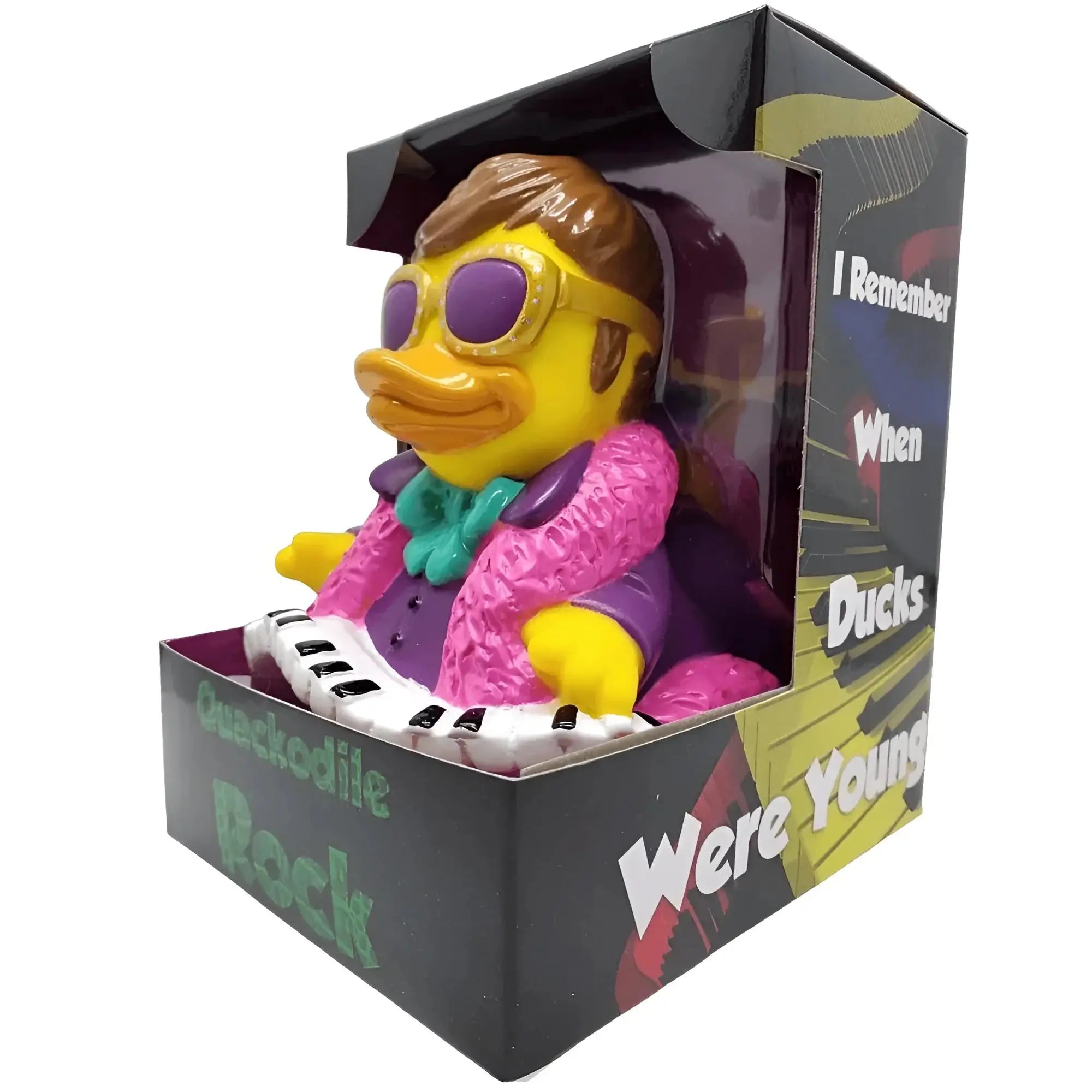 gelbe gummiente quackodile flock elton-parodie mit lila sonnenbrille rosa jacke und türkis fliege auf tastaturspielzeug