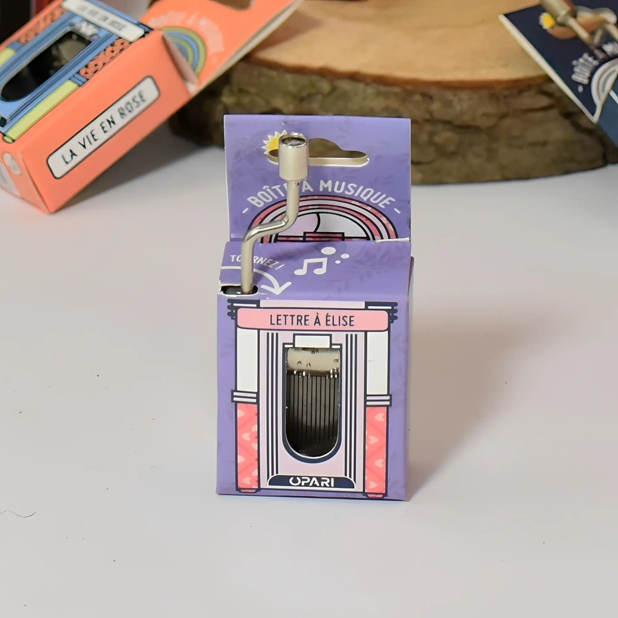 Kleine silberne spieluhr mit kurbelgriff verpackt in rosa lila box lettre à élise von opari