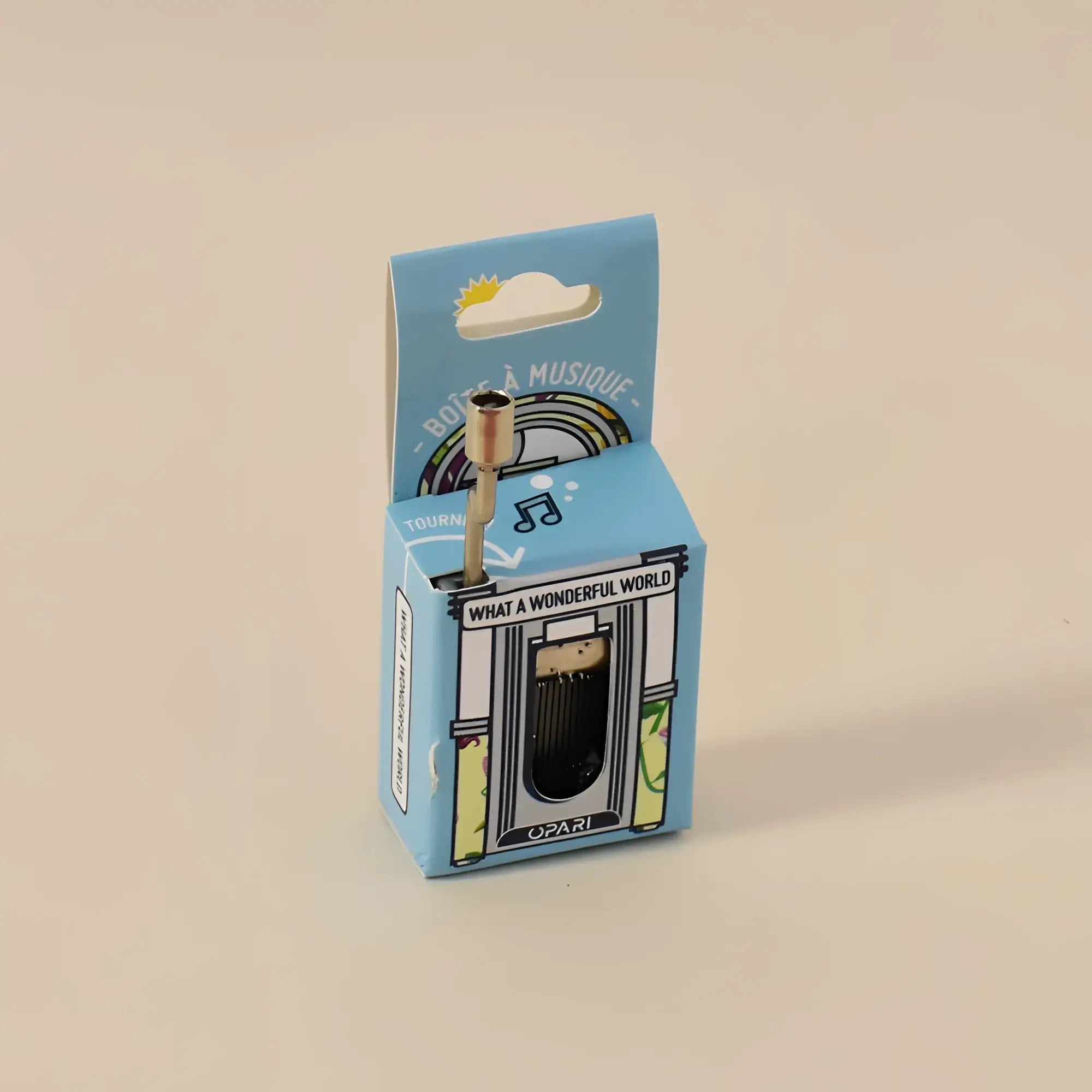 miniature brass spieluhr music box mit goldfarben top und schwarz Innenseite in Hellblau box mit musical notes und what wonderful world Text