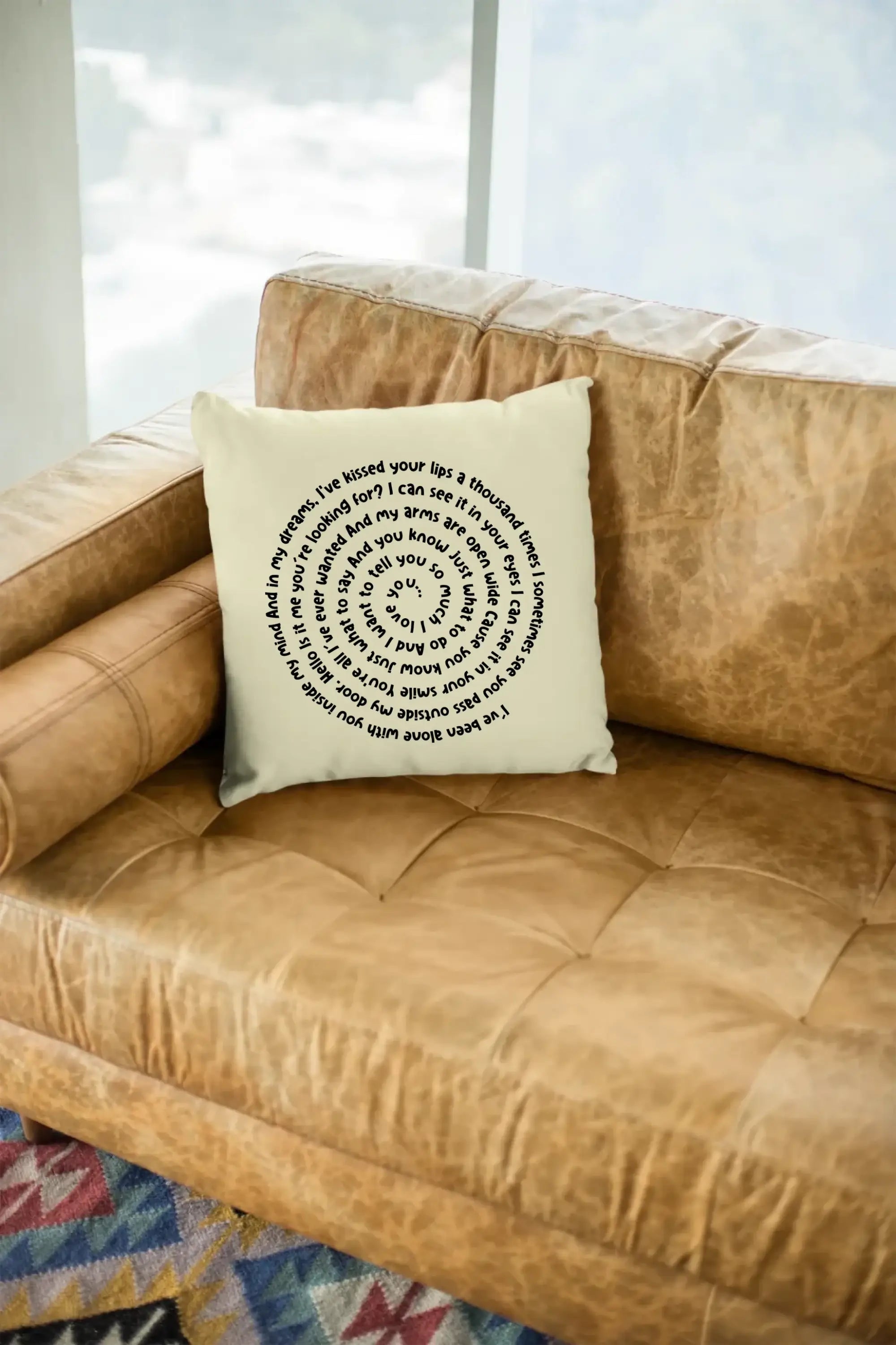mockup-of-a-square-pillow-sitting-on-a-leather-couch-23551