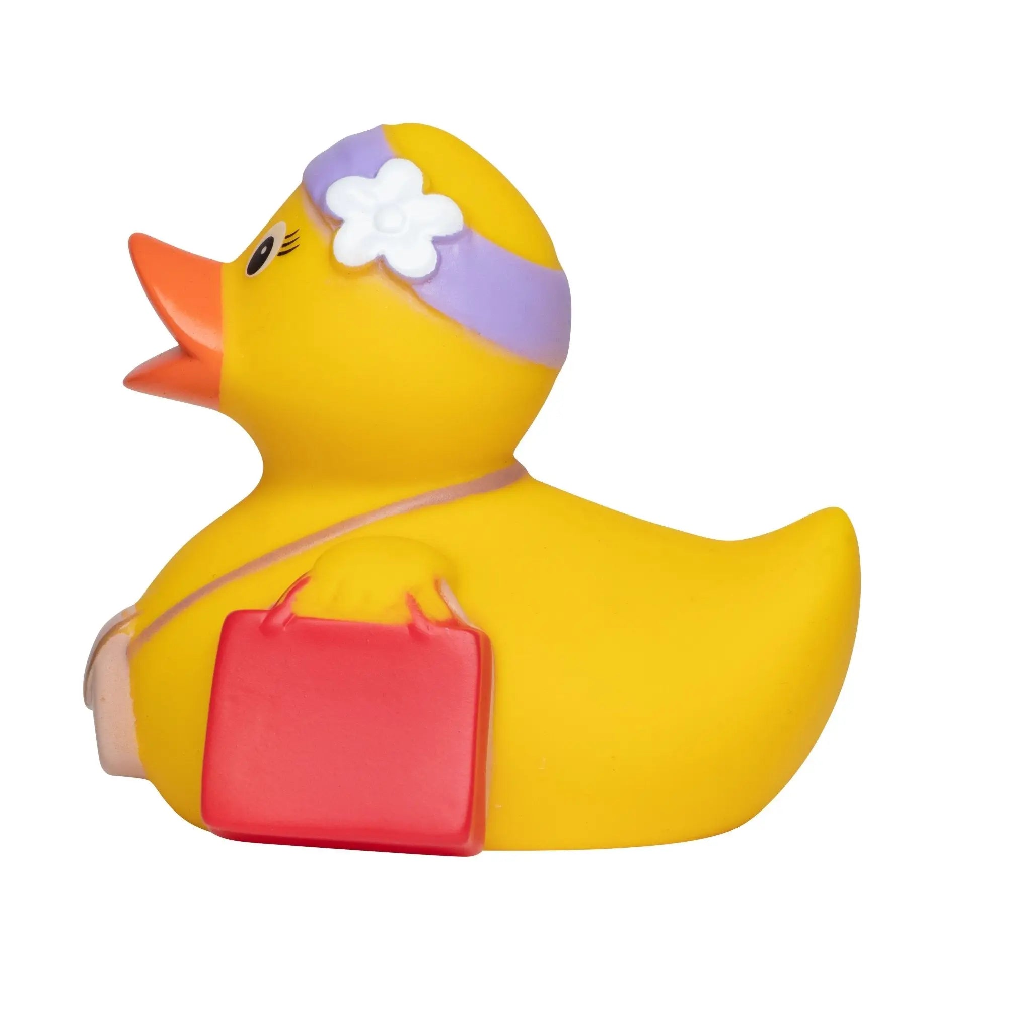 Gelbe badeente mit lila stirnband und weißer blume trägt rote tasche im bundle urlaub geschenkset quetschfigur