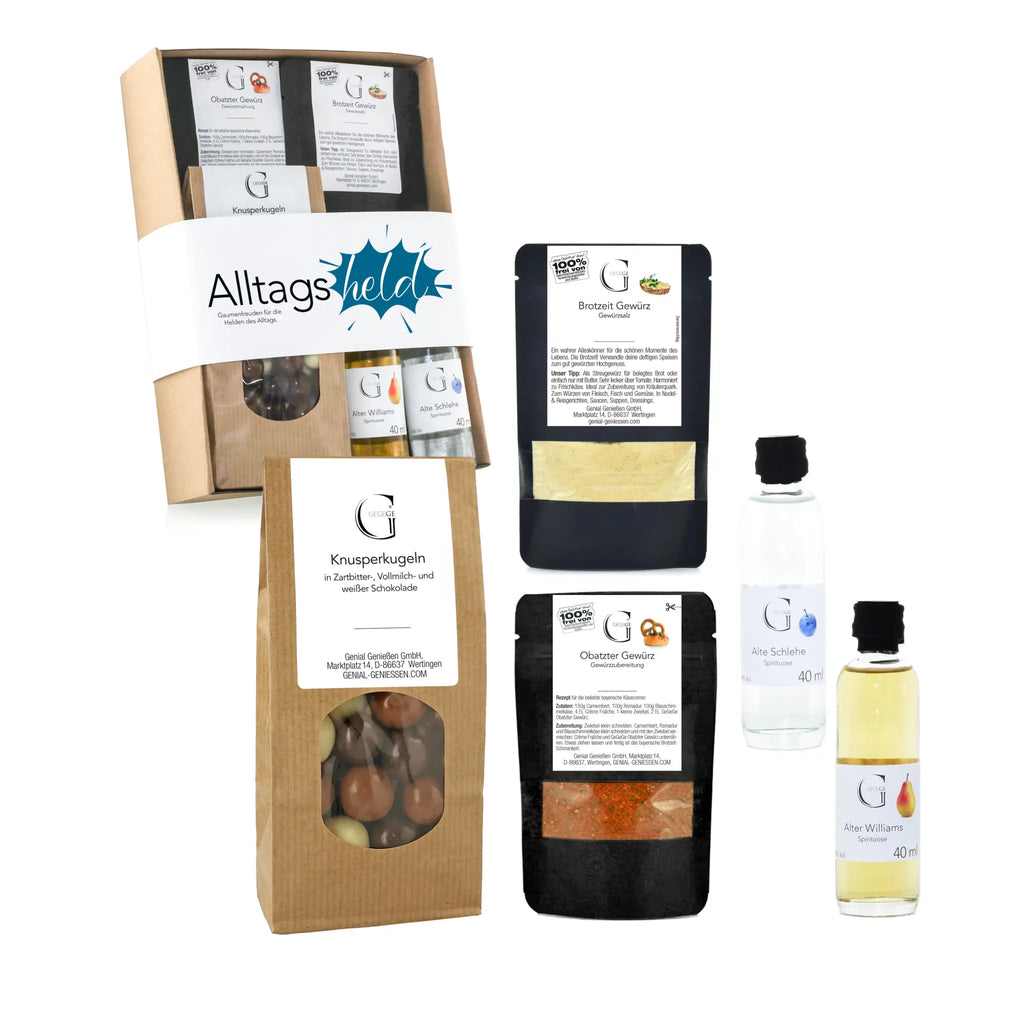 Braune geschenkbox aus karton mit durchsichtigem fenster zeigt assorted schokolade und label alltagsheld