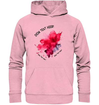 Ein weiches pinkes kapuzenpullover mit rotem und grauem aquarellklecks design aus der statement-collection