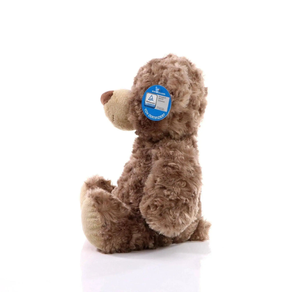 Ein brauner bär bodo plüschbär mit lockigem fell und beiger schnauze und pfoten als kuscheltier