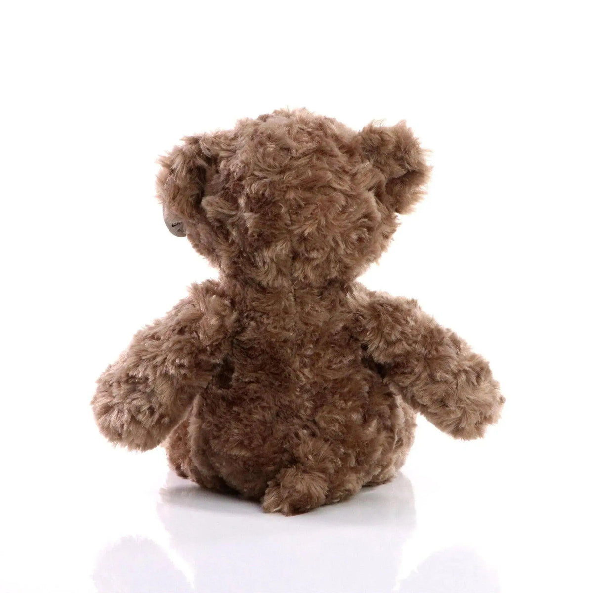 Fluffiger brauner bär bodo plüsch bär mit weichem lockigem fell und abgerundeten ohren als kuscheltier