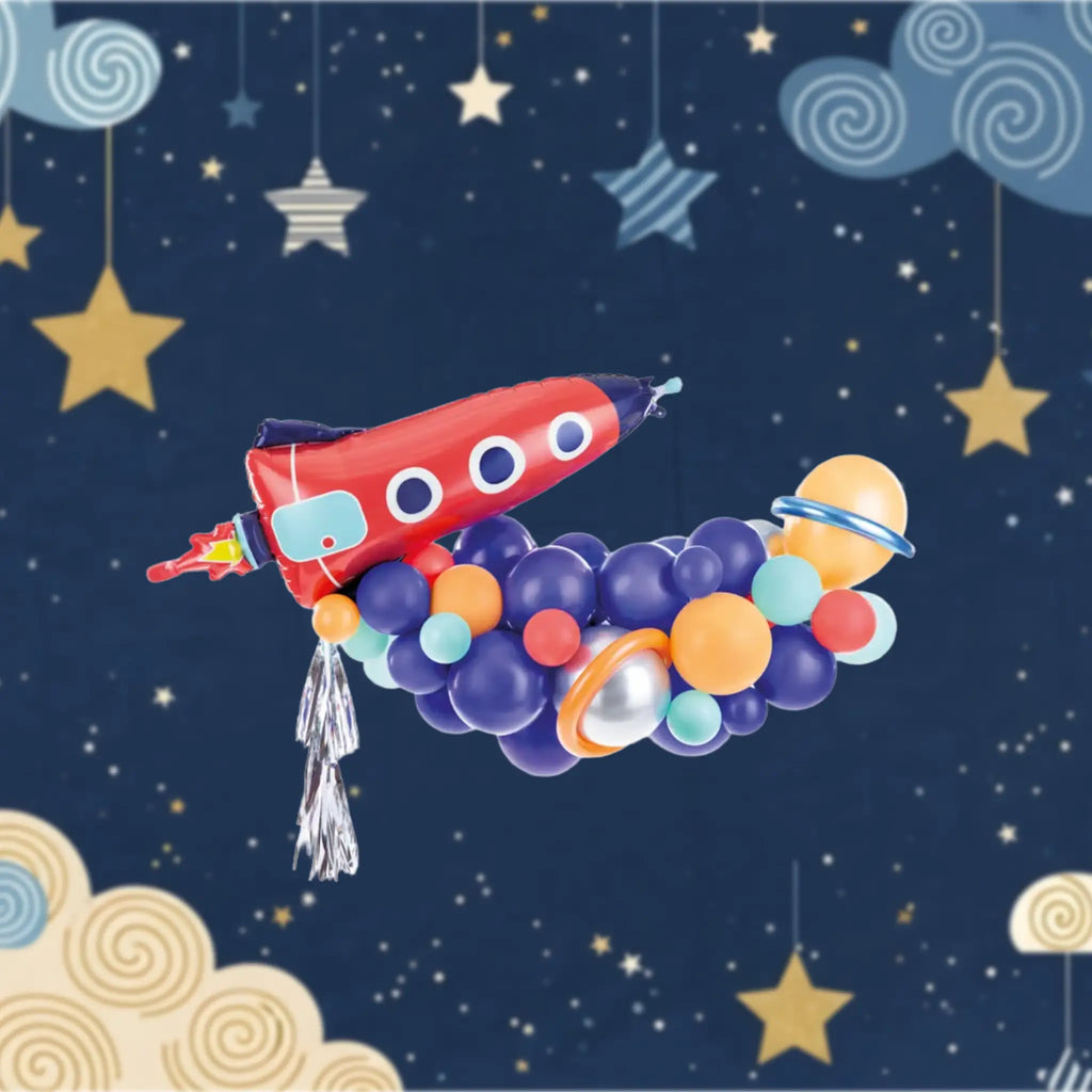 Ballon-set rakete mit rot-blauem folienballon und silberner quaste umgeben von bunten planetenluftballons