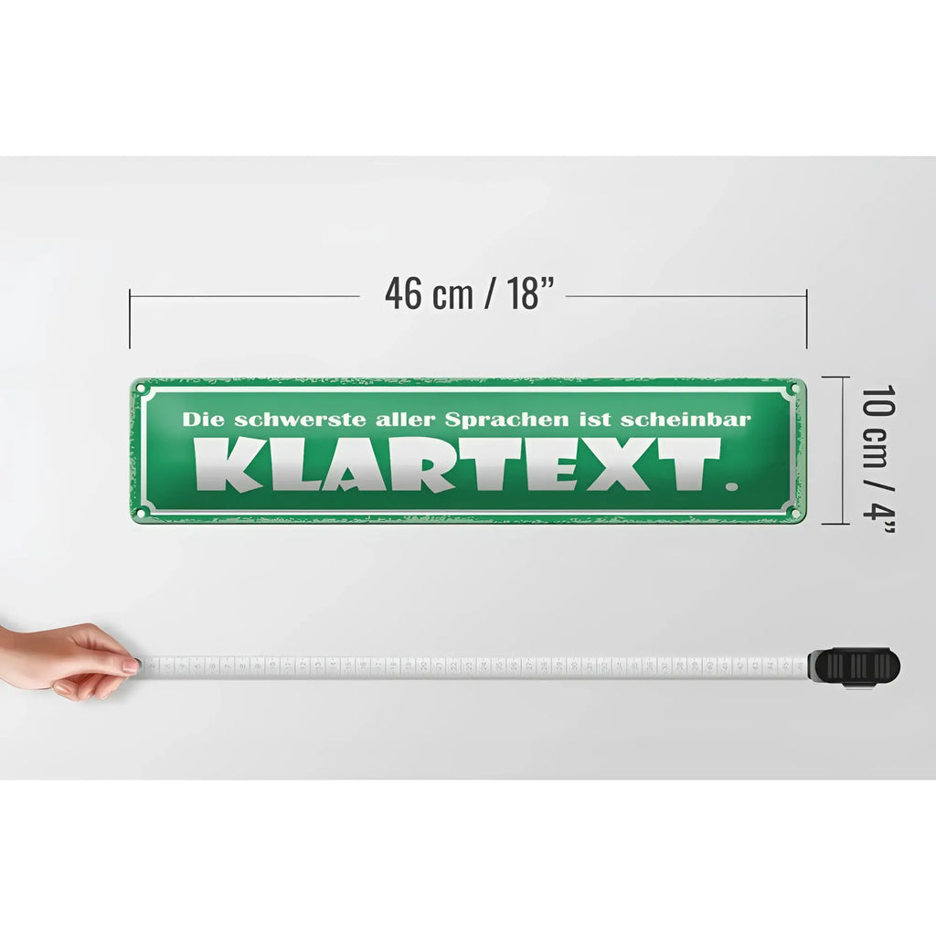 Grünes blechschild mit weißer schrift die schwerste aller sprachen ist scheinbar klartext 46x10 cm deko schild