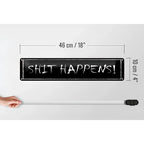 Black rectangular metal sign with white chalk-style shit happens lettering 46x10 cm metal decor gift