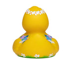 quietsche-ente badeente in leuchtendem gelb mit weißen kräutern und lila-blauen floralen mustern