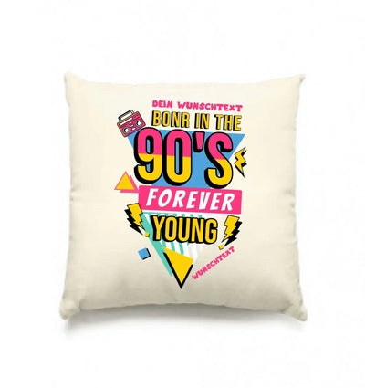 Creamfarbiges kissen mit auffälligem 90er jahre grafikdesign in rosa gelb blau born in 90s forever young