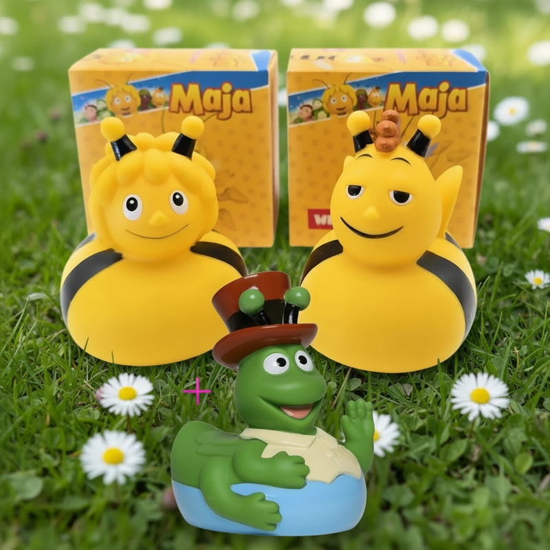 Gelbe badeente mit schwarzen streifen und antennen im bundle die biene maja mit freund willi und grashüpfer flip