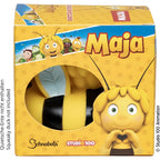 Gelbe und schwarze plastik biene maja figur mit flauschigem gelbem haar, grünen augen und lächelndem gesicht im geschenkpaket