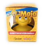 Gelbe badeente mit lächelndem gesicht und schwarzen streifen im originalverpackten die biene maja geschenkset