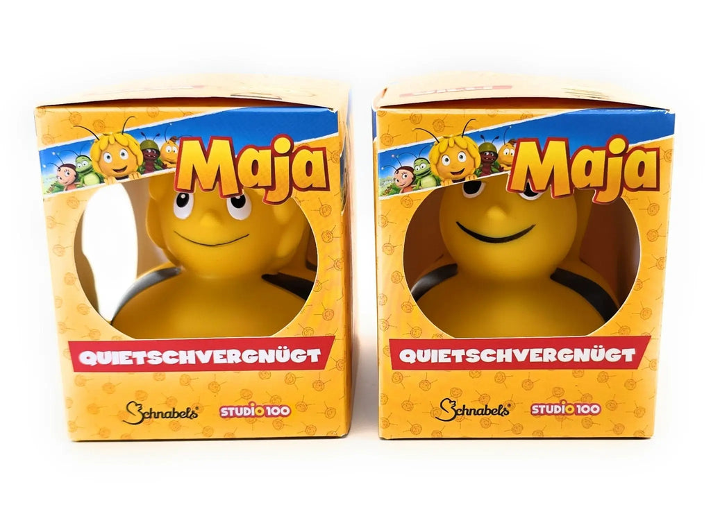 Gelbe badeente mit schwarzen antennen und lächelndem gesicht in der markenverpackung zum bundle von die biene maja und ihr bester freund willi