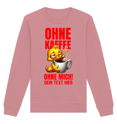 weiches rosa sweatshirt mit langärmel und einem gelben cartoon-ente-motiv das eine kaffeetasse hält