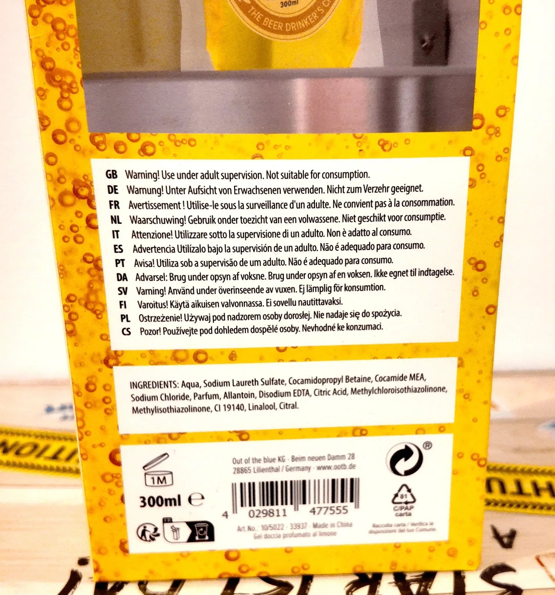Gelbe kartonverpackung der rückseite für 300ml duschgel mit zitronenduft in pet-beutel von out von blau ks