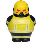 Gelbe und marineblaue feuerwehrmann-feuerwehr-ente mit roten helm-markierungen als anti-stress-figur