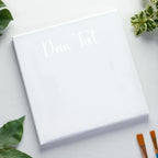 Weisse foto-leinwand mit dein text in feiner cursive gravur auf keilrahmen personalisiertes fotogeschenk 45x45 cm