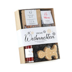 Frohe weihnachten geschenkset s mit weißem band und gold schneeflocken enthält gingerman bonbon hüttenzaubler likör und feuerzangenbowle treats