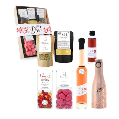 Eine roségoldene champagnerflasche mit frostigem glitzereffekt und schwarzer kalligraphie im für dich geschenkset