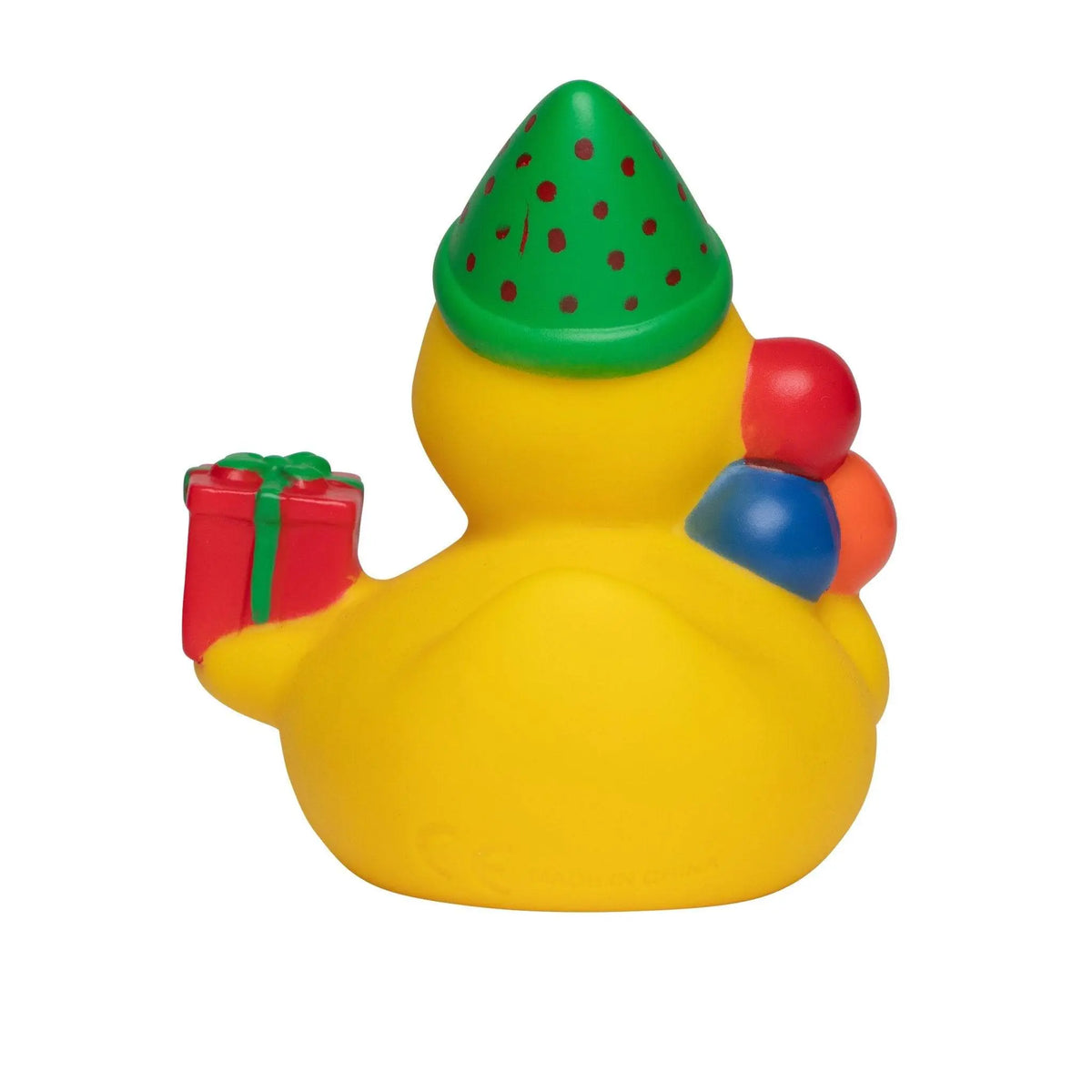 Gelbe quietsche-ente mit grünem gepunktetem partyhut und rotem geschenk für geburtstag spaß im bad