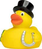 Gelbe quietsche-ente mit schwarzem zylinder und silbernem hufeisen als glücksbringer badeente
