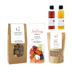 A clear plastic bag of colorful vegan bear-shaped fruit gummies labeled lieblings bären in the hobby-set fahrradspaß präsentkorb
