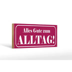 Ein rechteckiges holzschild 27x10cm in magenta mit weißem spruch alles gute zum alltag dekorativ und modern