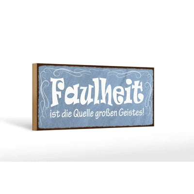Blaues holzschild mit weißer dekorativer schrift und dunklem rahmen spruch faulheit quelle großen geistes