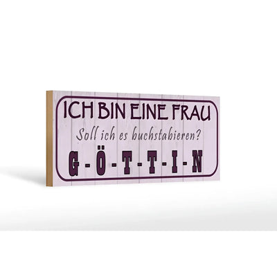 Ein rechteckiges holzschild mit helllila vintage holzmaserung und dunkelroter schrift ich bin eine frau gottin für deko