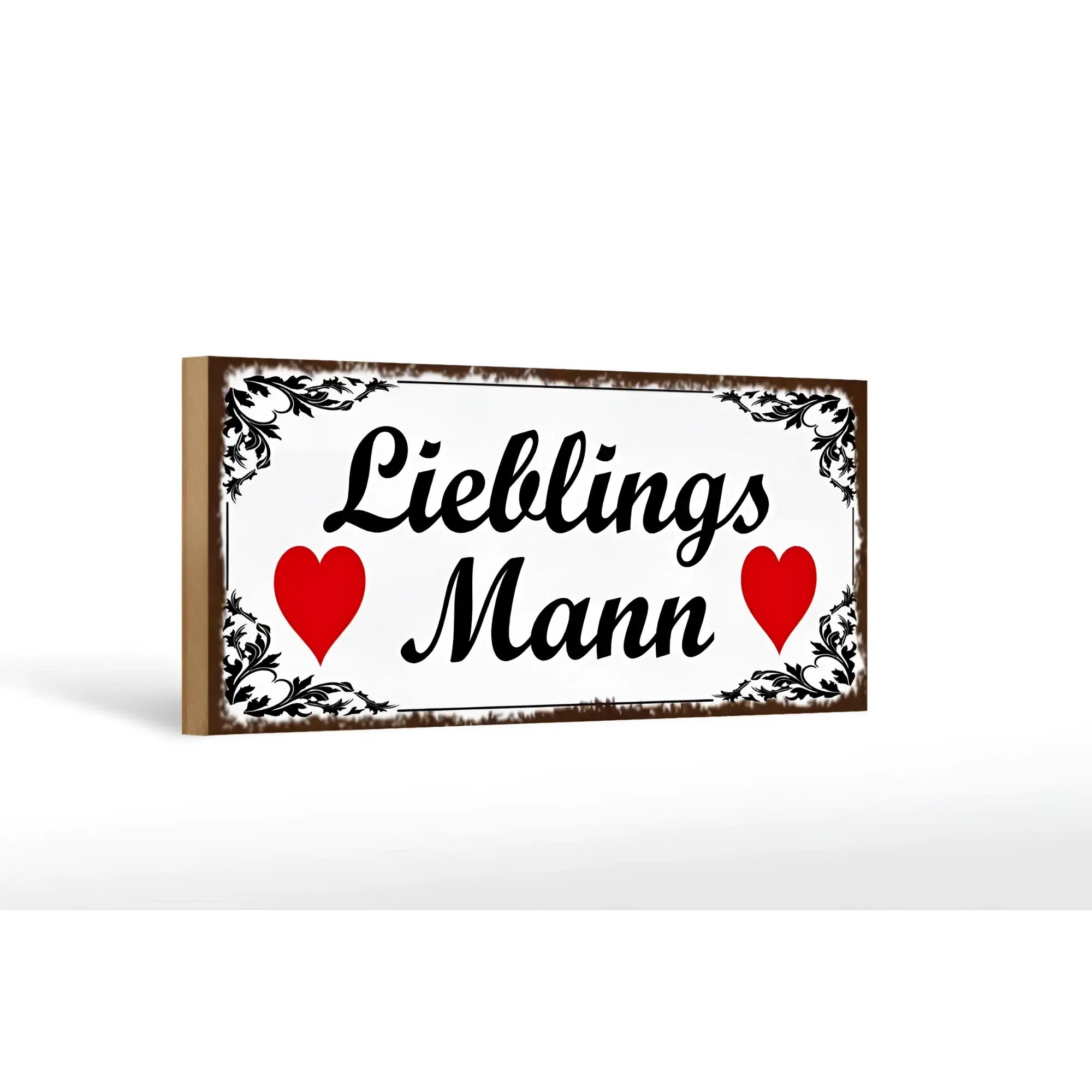 Weißes rechteckiges holzschild mit schwarzem ornamentrahmen und text lieblings mann zwischen zwei roten herzen
