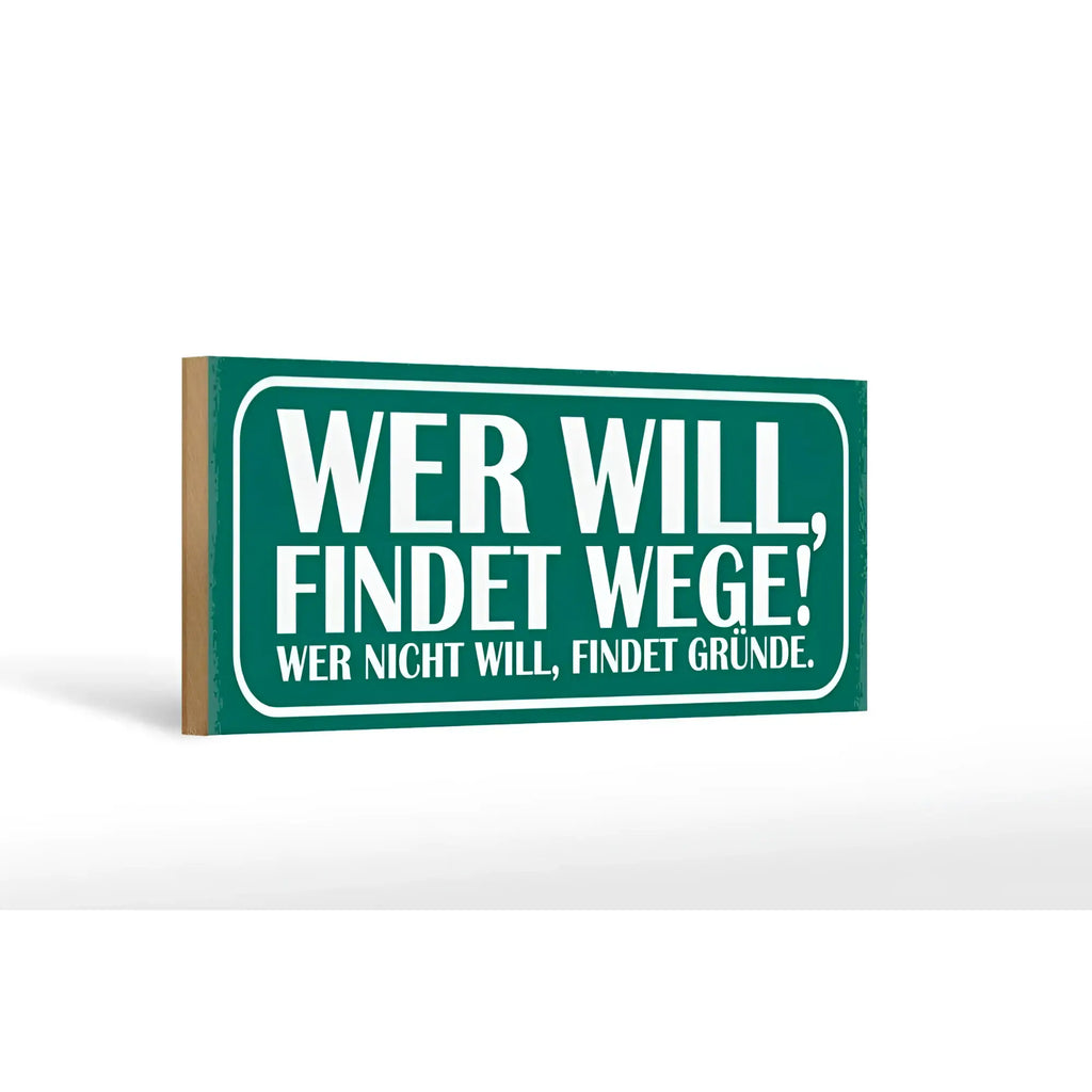 Grünes rechteckiges holzschild 27x10cm mit weißer schrift spruch wer will findet wege wer nicht findet gründe