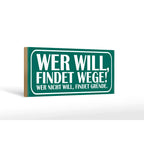 Grünes rechteckiges holzschild 27x10cm mit weißer schrift spruch wer will findet wege wer nicht findet gründe