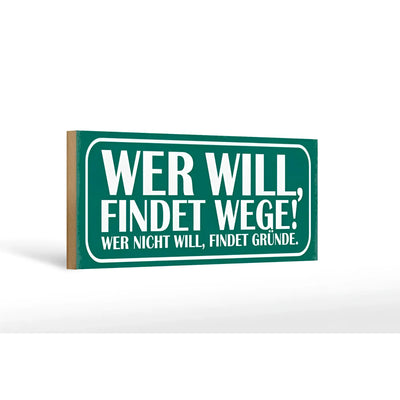 Grünes rechteckiges holzschild 27x10cm mit weißer schrift spruch wer will findet wege wer nicht findet gründe