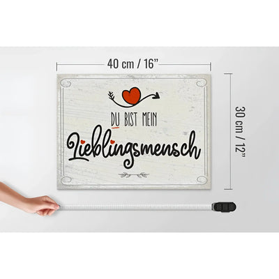 Rechteckiges graues holzschild 30x40cm mit weißer distressed optik und schwarzem spruch du bist mein lieblingsmensch plus rotem herz