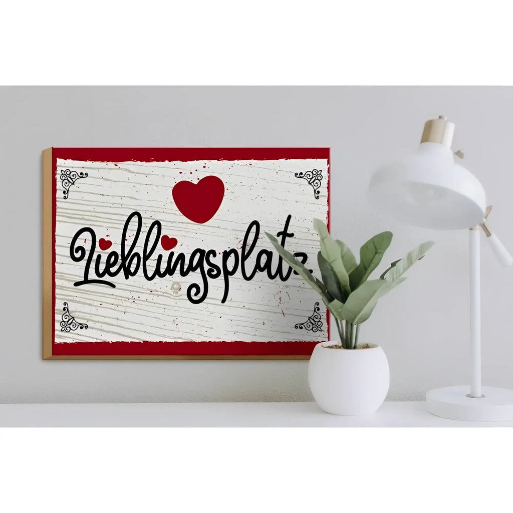 Holzschild 30x40cm mit rotem rahmen und herz auf weißem hintergrund mit schwarzem lieblingsplatz schriftzug