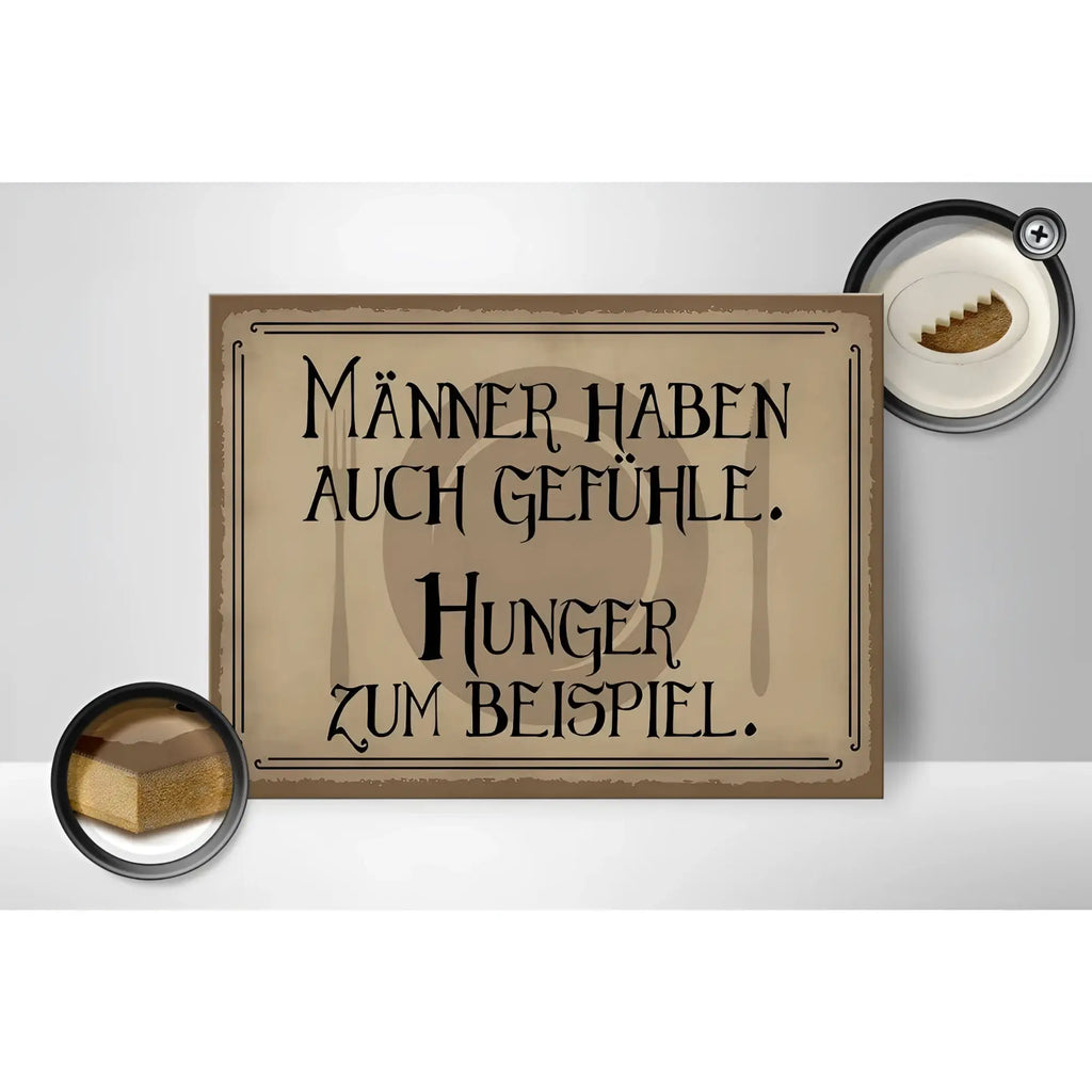 Ein rechteckiges beiges holzschild mit schwarzer verzierter schrift männer haben auch gefühle in 40x30cm
