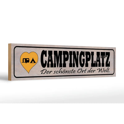 Ein rustikales beiges holzschild 46x10 cm mit schwarzer schrift campingplatz und gelbem herz mit wohnwagen und zelt