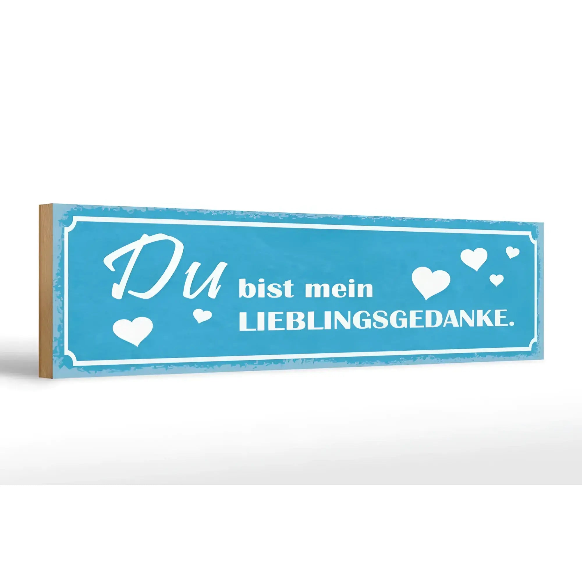 Blaues rechteckiges hölzernes schild mit weißem schriftzug du bist mein lieblingsgedanke und herzmotiven zur deko