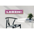 Lila holzschild mit weißem schriftzug genieße dein leben rahmen aus hellem holz 46x10cm deko