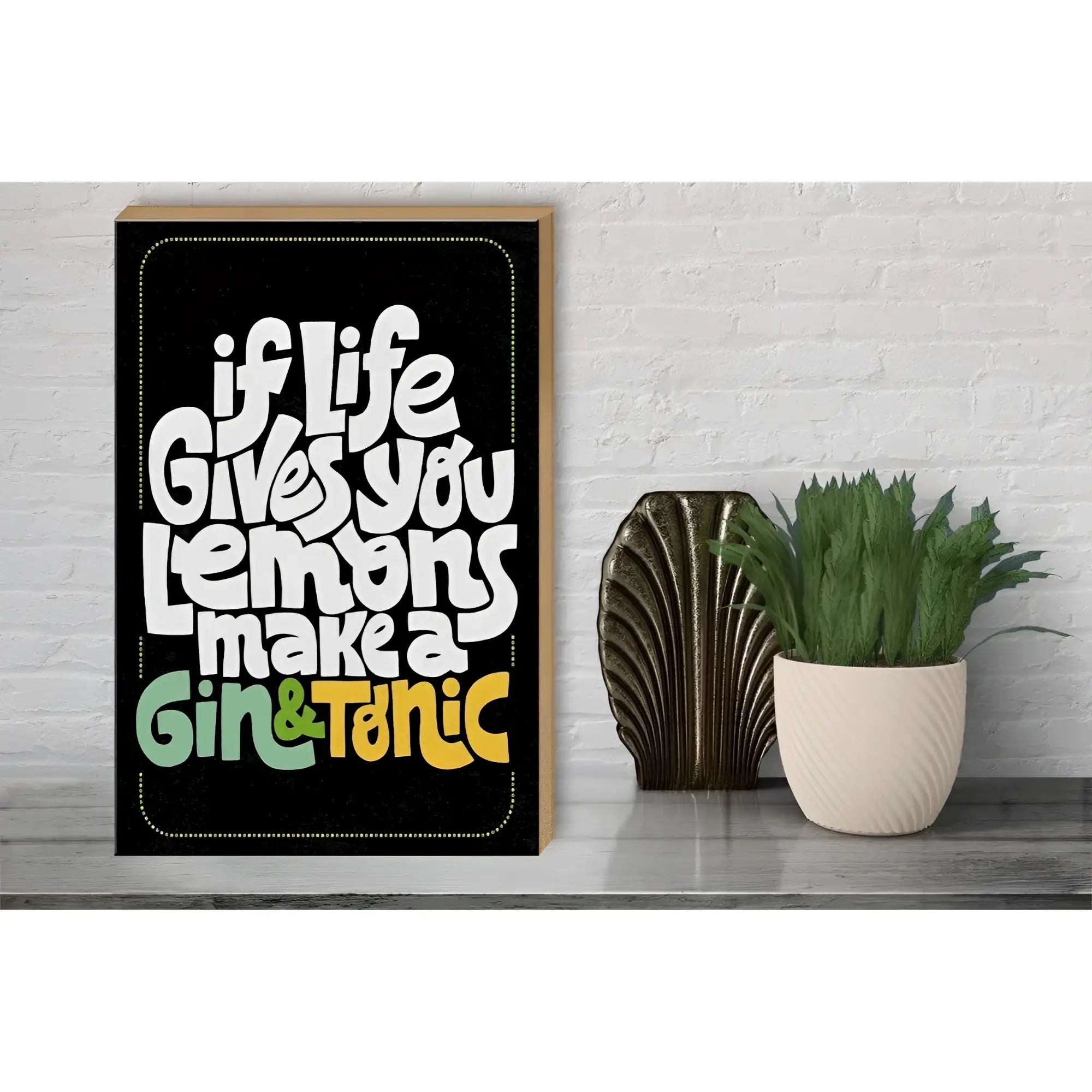 Black framed holzschild with bold white and colorful lettering saying if life gives lemons make gin tonic 30x40cm