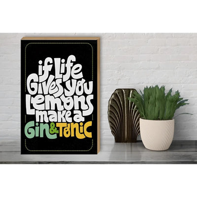 Black framed holzschild with bold white and colorful lettering saying if life gives lemons make gin tonic 30x40cm